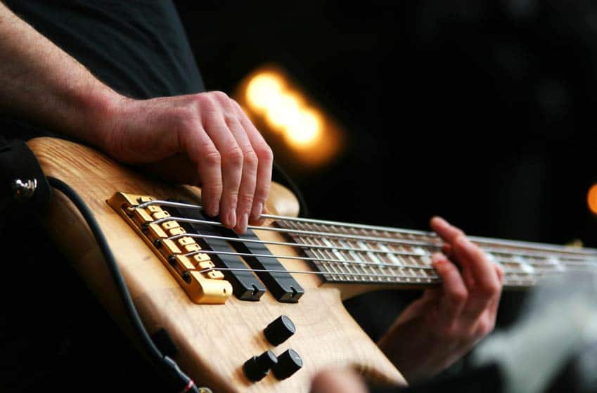 Closeup shot of bassist playing