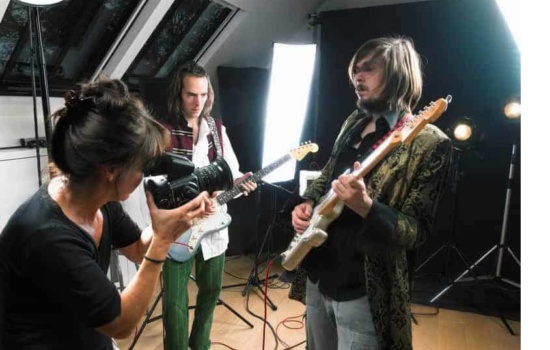 Bandmates and director shooting a music video