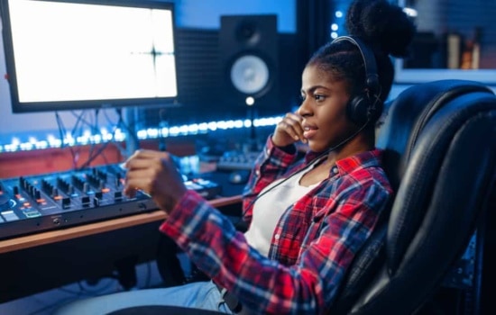 Black female producer in her home studio setup