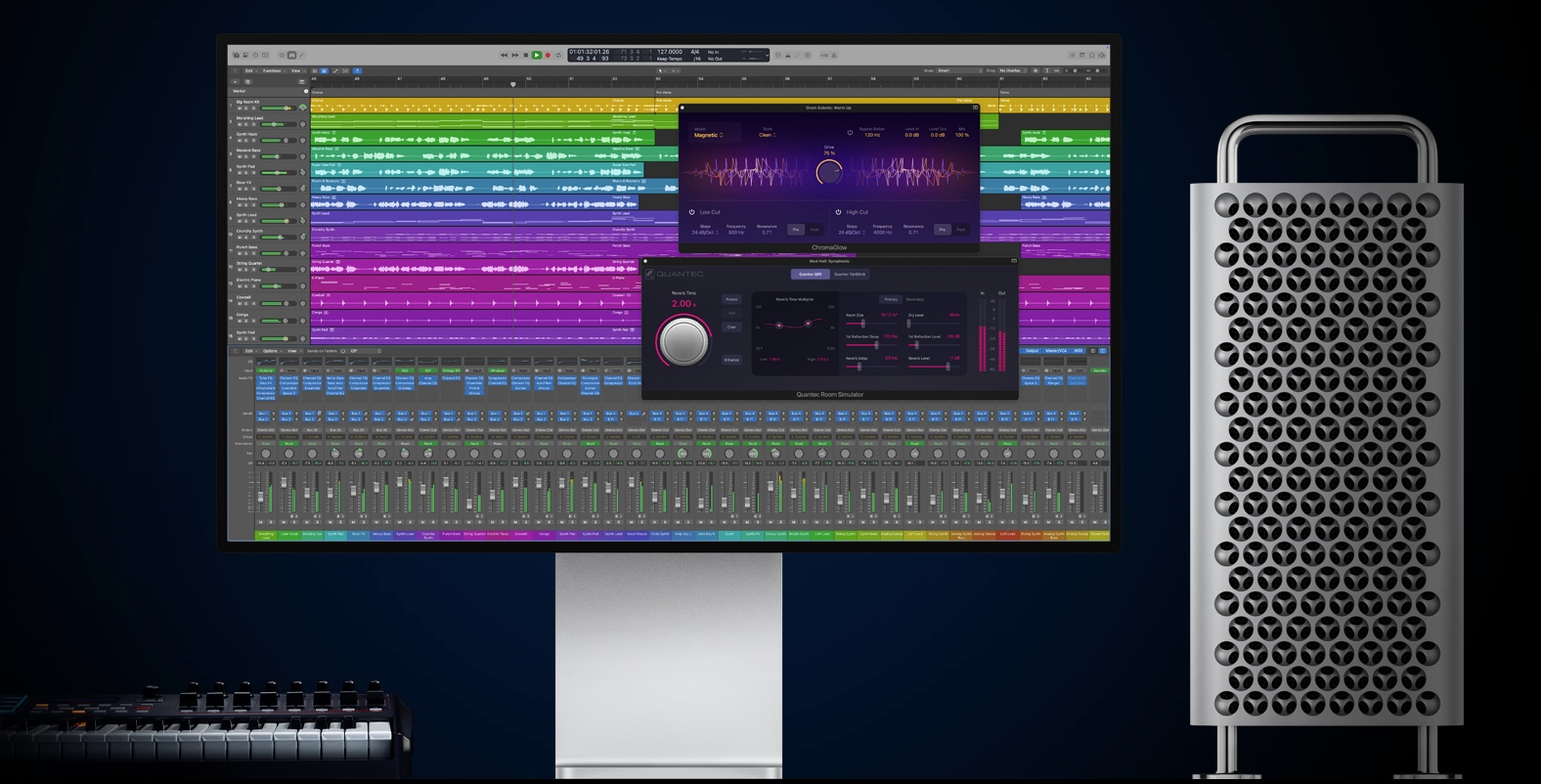 Apple Logic Pro running on an Apple screen next to a Mac and MIDI keyboard